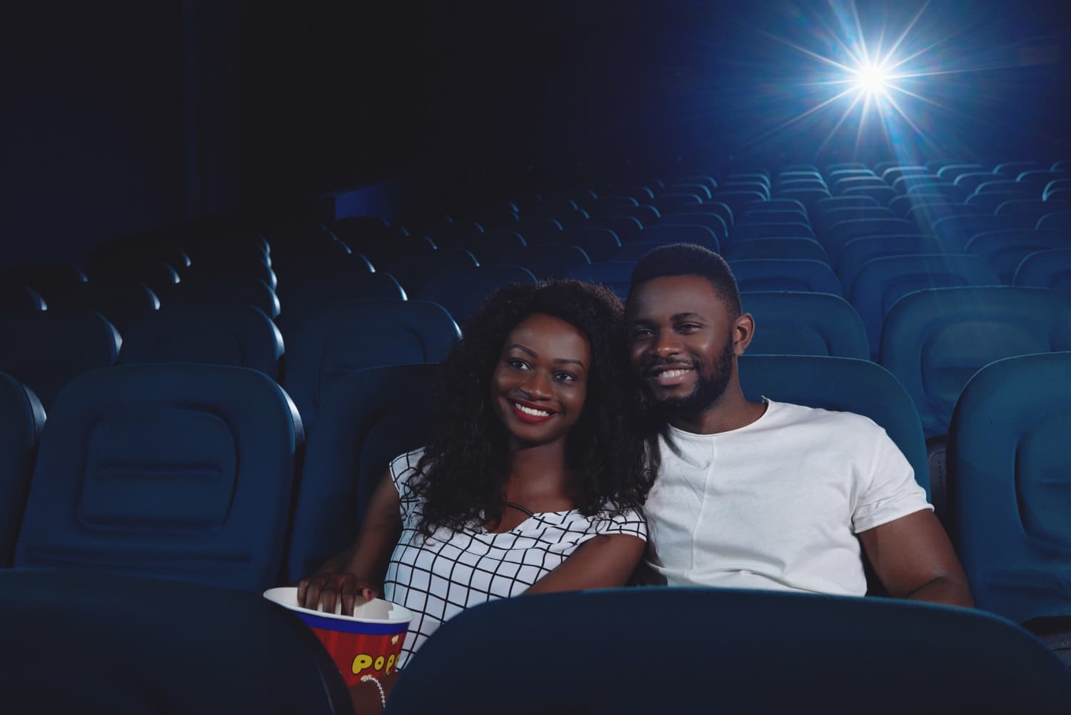 couple of africans watching funny movie